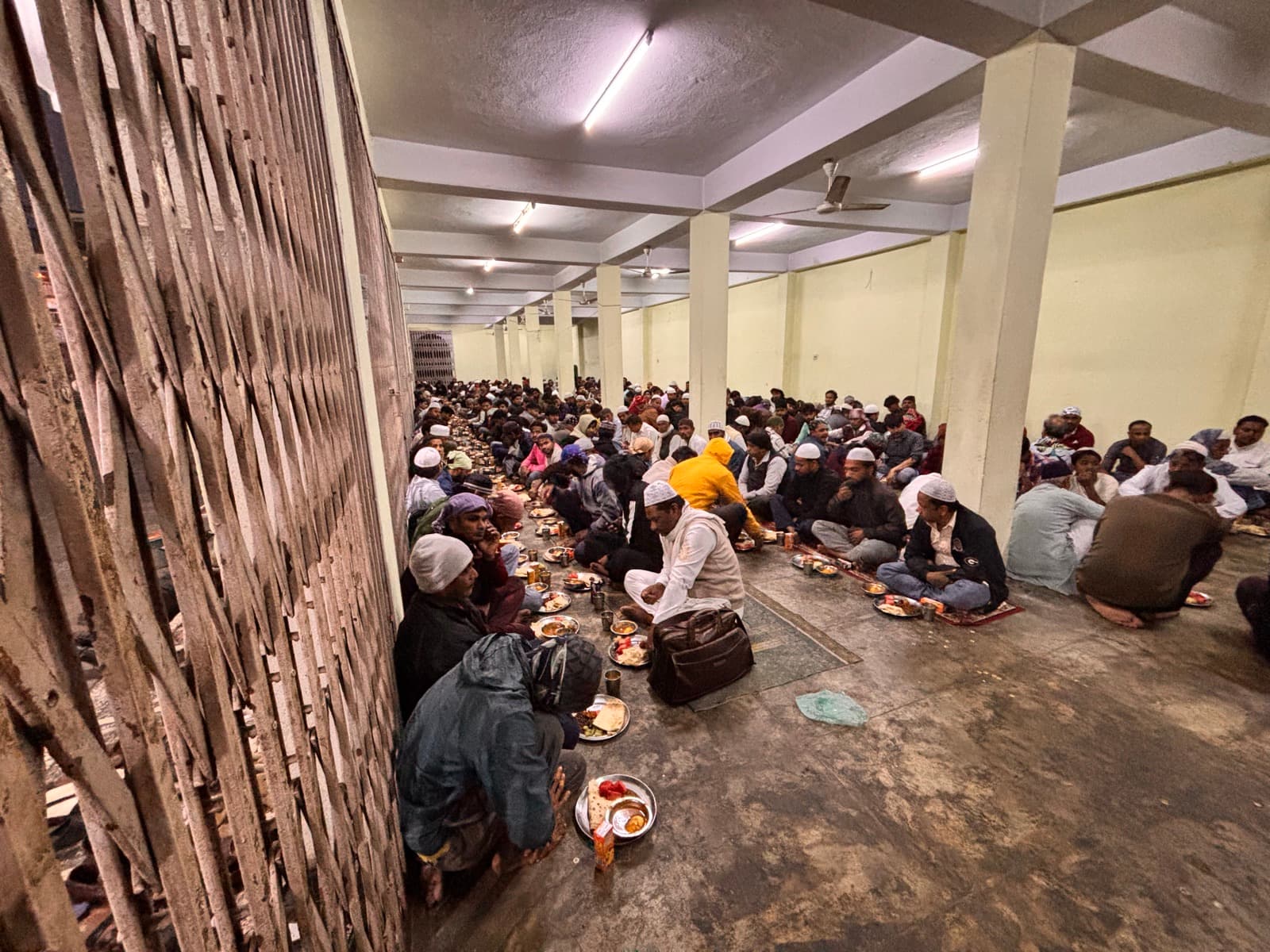 People sitting in rows during the community iftar